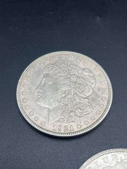 FIVE MORGAN SILVER DOLLARS