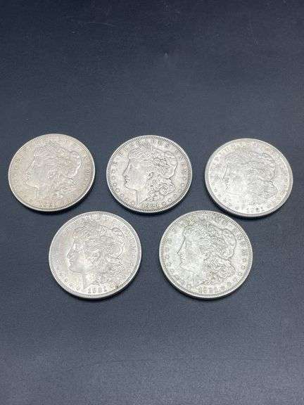 FIVE MORGAN SILVER DOLLARS