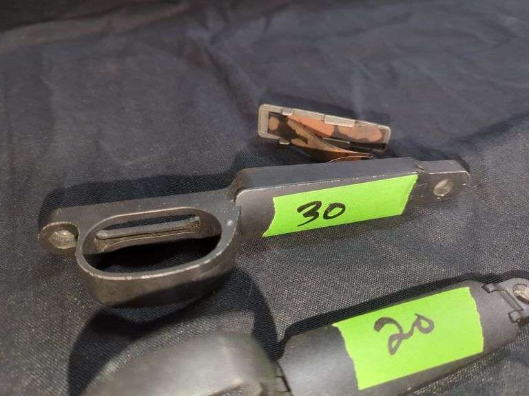 Assorted Rifle Parts: Triggers, Housing, and Magazine Release
