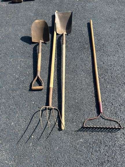 Group of Garden Tools: Rake, Shovels, and Pitchfork image