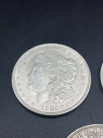 FIVE MORGAN SILVER DOLLARS