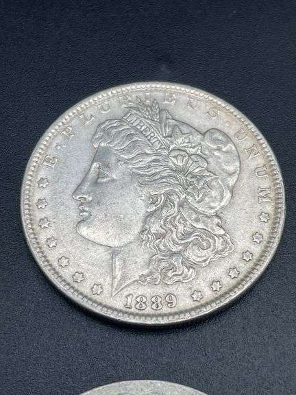 FOUR MORGAN SILVER DOLLARS