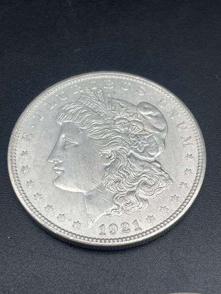 FIVE MORGAN SILVER DOLLARS