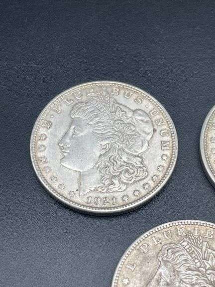 FIVE MORGAN SILVER DOLLARS