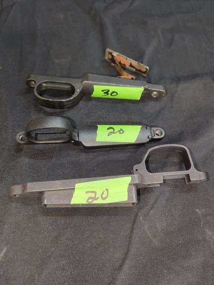 Assorted Rifle Parts: Triggers, Housing, and Magazine Release