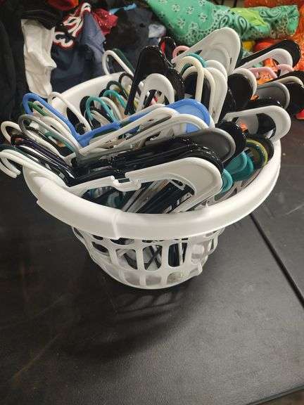 CLOTHES HANGERS AND LAUNDRY BASKET image