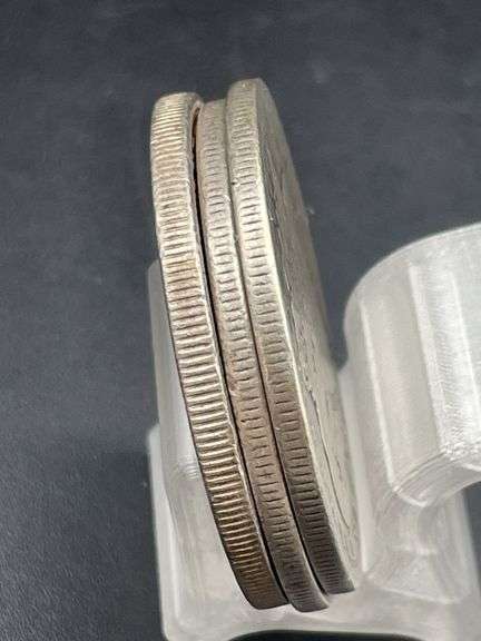 THREE MORGAN SILVER DOLLARS