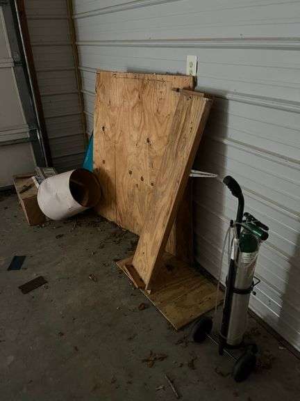 Oxygen Tank on Wheels with Wood Panels and Other Items image