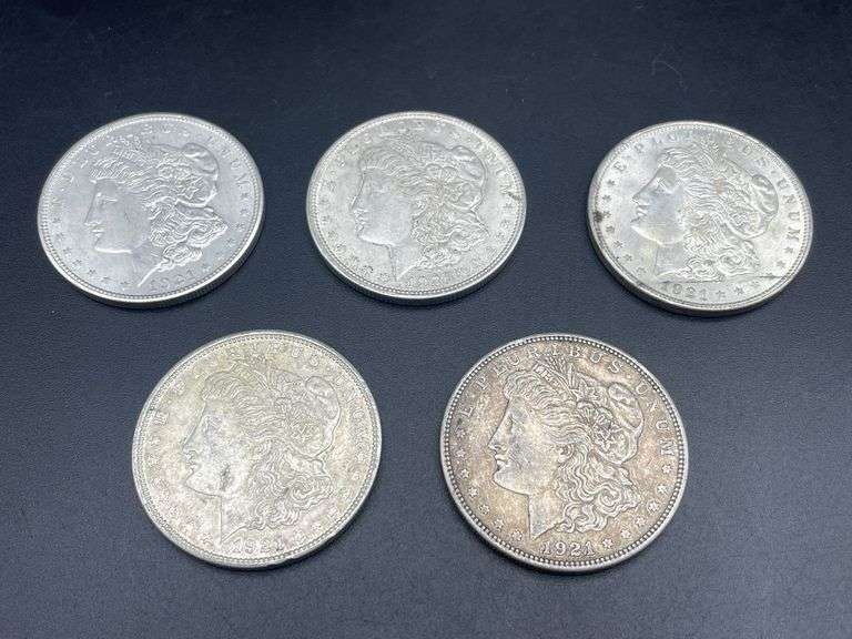 FIVE MORGAN SILVER DOLLARS
