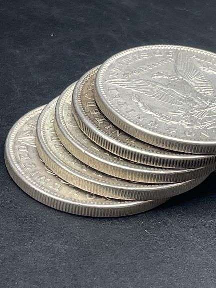 FIVE MORGAN SILVER DOLLARS