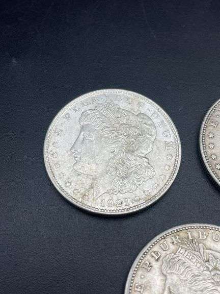 FIVE MORGAN SILVER DOLLARS