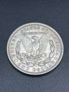 FIVE MORGAN SILVER DOLLARS