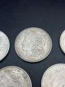 FIVE MORGAN SILVER DOLLARS