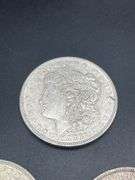 FIVE MORGAN SILVER DOLLARS