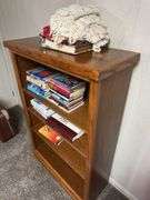 Wooden Bookcase with Books and Crochet