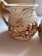 Set of Four "Shelah '84" Relief Design Pitchers