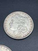 THREE MORGAN SILVER DOLLARS