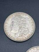 THREE MORGAN SILVER DOLLARS