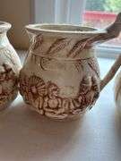 Set of Four "Shelah '84" Relief Design Pitchers
