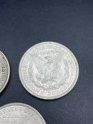 FIVE MORGAN SILVER DOLLARS