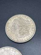 FIVE MORGAN SILVER DOLLARS