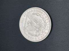FIVE MORGAN SILVER DOLLARS