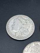 THREE MORGAN SILVER DOLLARS