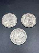 THREE MORGAN SILVER DOLLARS