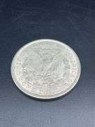 FIVE MORGAN SILVER DOLLARS