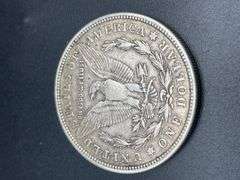 FIVE MORGAN SILVER DOLLARS