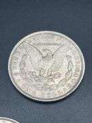 THREE MORGAN SILVER DOLLARS
