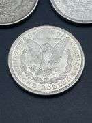 FIVE MORGAN SILVER DOLLARS
