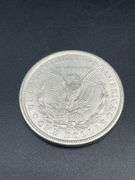 FIVE MORGAN SILVER DOLLARS