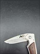Three Pocket Knives: Smith & Wesson, Ozark Trail, and Tac-Force