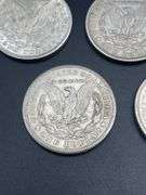 FIVE MORGAN SILVER DOLLARS