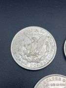 FIVE MORGAN SILVER DOLLARS