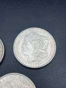 FIVE MORGAN SILVER DOLLARS