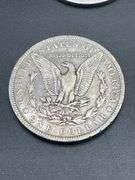 FOUR MORGAN SILVER DOLLARS