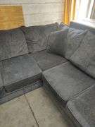 3 PIECE - SECTIONAL COUCH - CHARCOAL GRAY - COUPLE BOARDS LOOSE IN BACK DOES NOT AFFECT SITTING