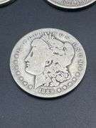 FOUR MORGAN SILVER DOLLARS