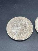 FIVE MORGAN SILVER DOLLARS