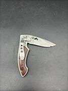 Three Pocket Knives: Smith & Wesson, Ozark Trail, and Tac-Force