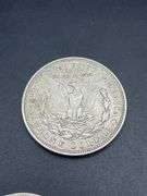 FIVE MORGAN SILVER DOLLARS
