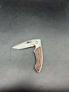 Three Pocket Knives: Smith & Wesson, Ozark Trail, and Tac-Force