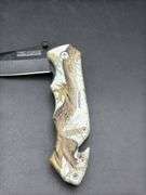 Three Pocket Knives: Smith & Wesson, Ozark Trail, and Tac-Force