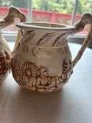Set of Four "Shelah '84" Relief Design Pitchers