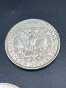 FIVE MORGAN SILVER DOLLARS