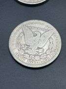 FOUR MORGAN SILVER DOLLARS