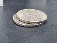 TWO MORGAN SILVER DOLLARS