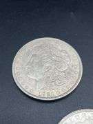 FIVE MORGAN SILVER DOLLARS